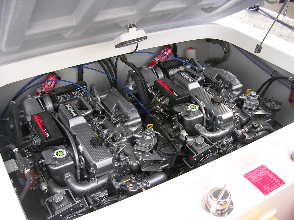 An inboard engine installation inside a boat's engine bay.